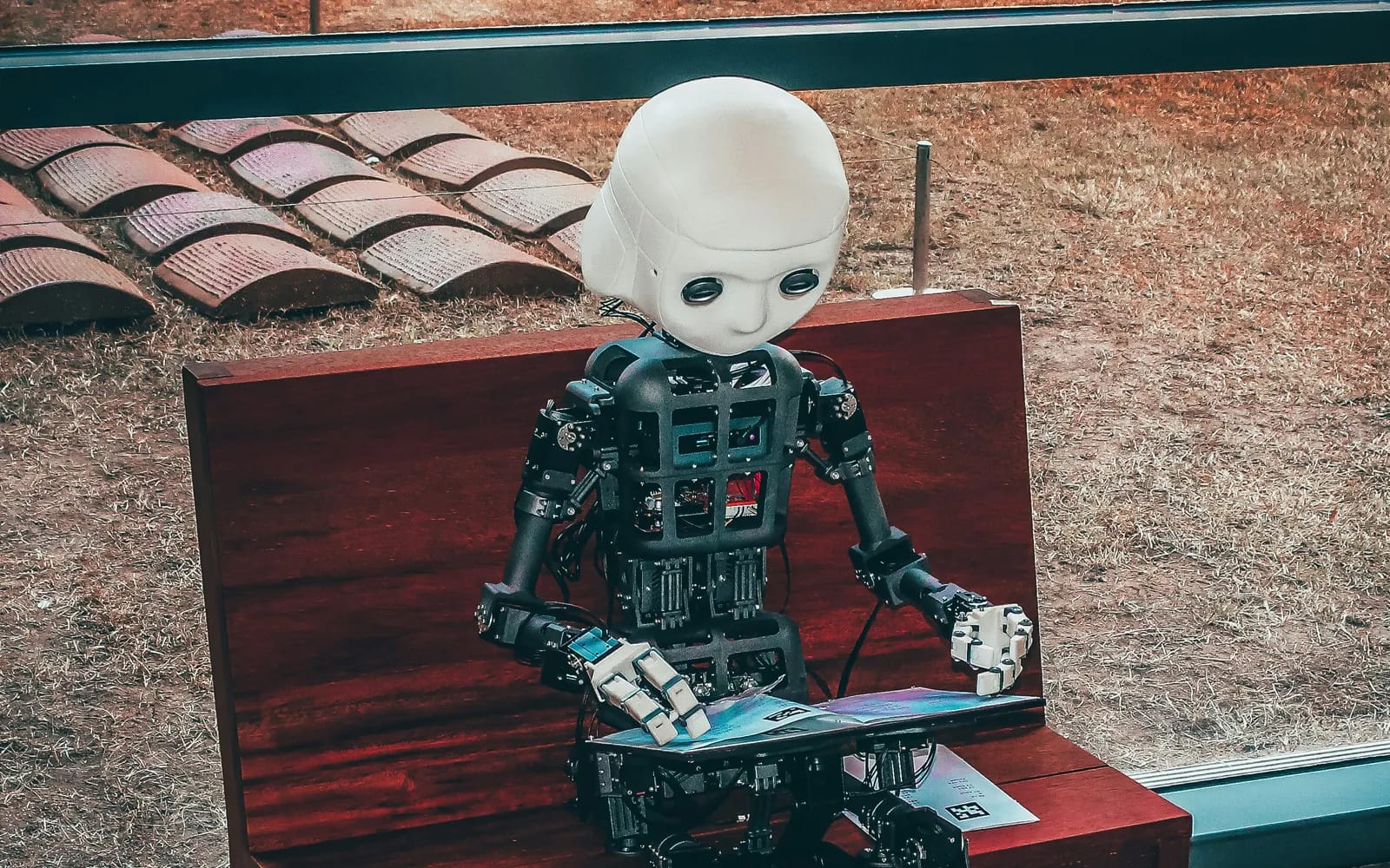 Office scene with multiple people collaborating while looking at different screens