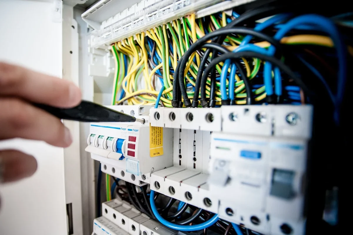 Electrical breaker panel with multiple circuit breakers arranged in rows